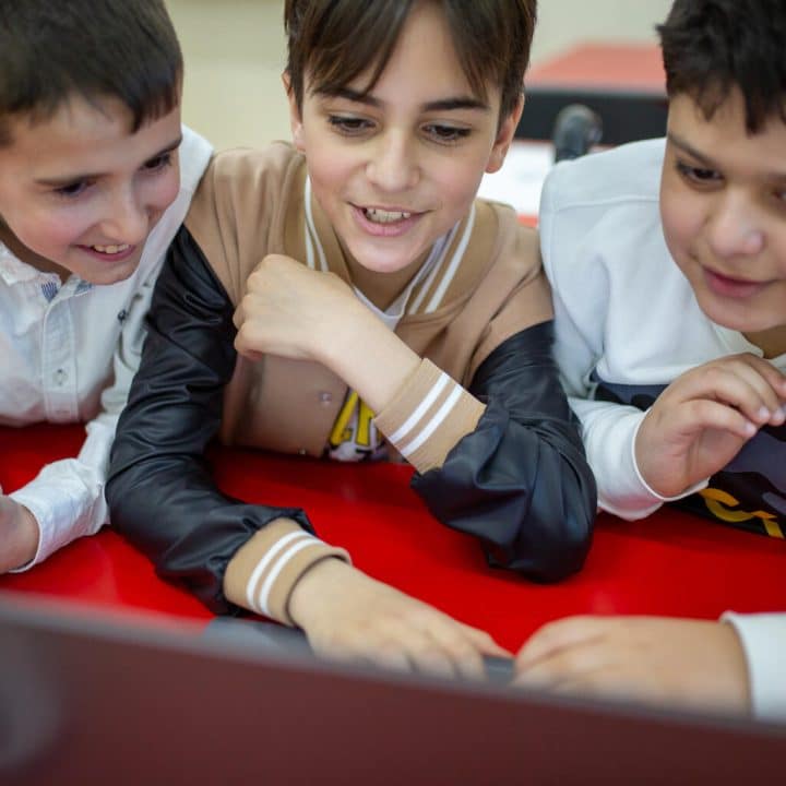 Three boys participating in Information technology lesson. March, Vanadzor, Armenia Information Technology lesson in one of the schools in Vanadzor. © UNICEF/UNI448309/Mahari